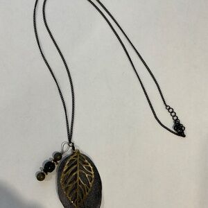 Long black chain with hanging charms